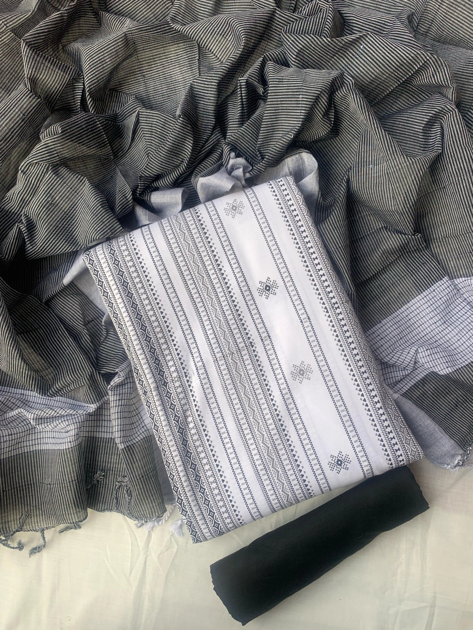 Unstitched Slub cotton three-piece.